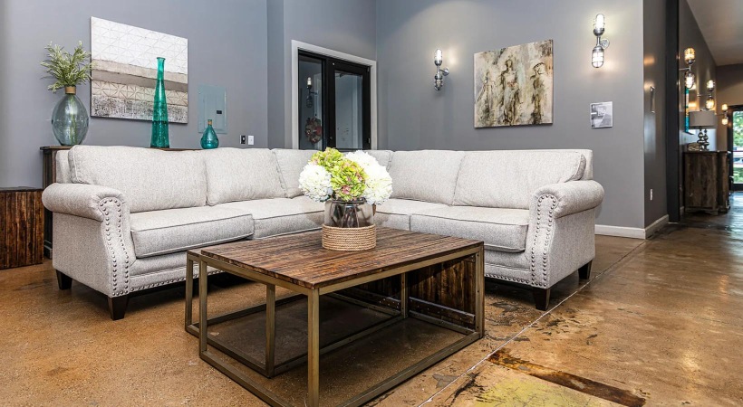 a living room with a couch and coffee table