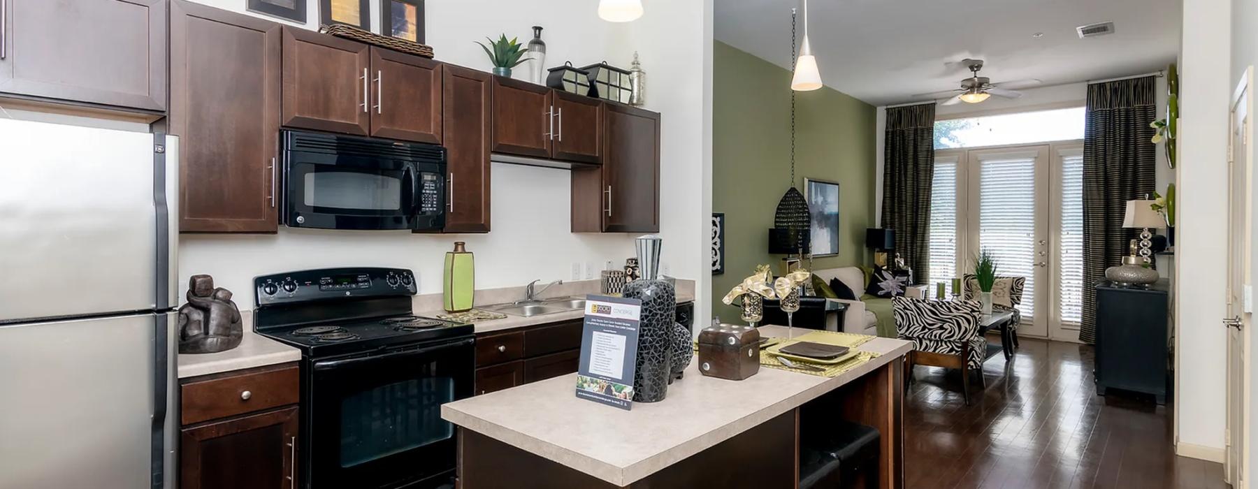 a kitchen with a bar and a dining table